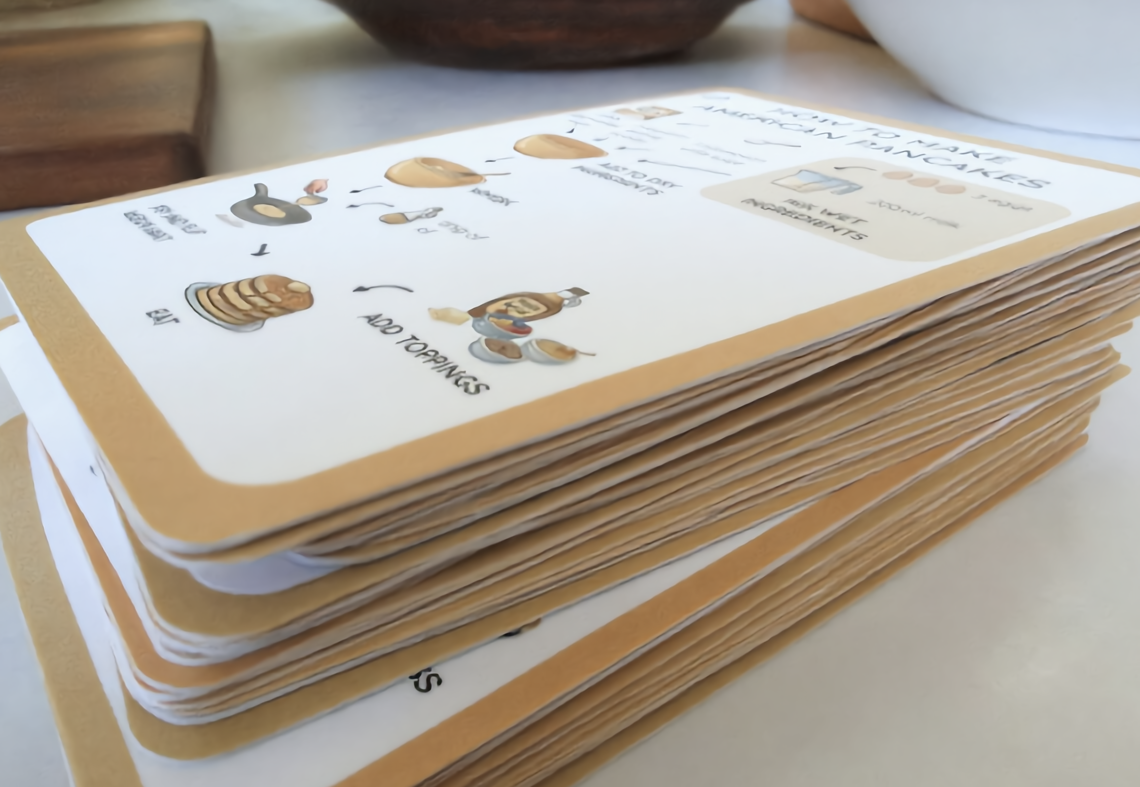 Stacks of ClearCook visual recipe cards being prepared for orders